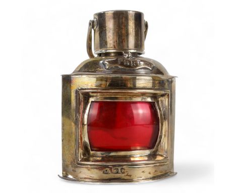 A silver table lighter modelled as a ship's port light - London 1897, Samuel Jacob, of quadrant form, 8cm high, 109g.