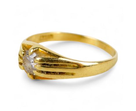 An 18ct gold diamond set ring - with rub-over setting, size R, 3.7g.