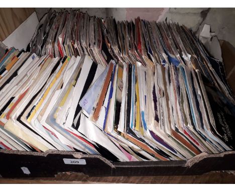 A box containing approx 300 vinyl singles. Various genres and artistes including Bob Marley and the Wailers, K C and THe Suns