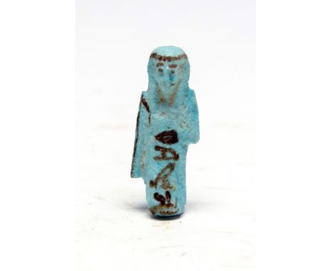 Egyptian Faience Overseer Shabti, Third Intermediate Period, 1070 - 718 BC. An oversheer shabti wearing the kilt of everyday 