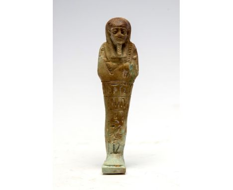 Egyptian Bright Faience ShabtiLate Period, C. 664 - 332 BC.An Egyptian faience shabti with clear hieroglyphs and design surro