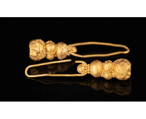 Gold Earrings with Filigree. Roman - 2nd - 4th Century ADA pair of gold earrings with long body and filigree decoration.Ex. P