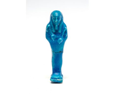Egyptian Ptolemaic Period Faience ShabtiC. 4th Century BC.A bright blue faience mummiform ushabtis, wearing a tripartite wig 