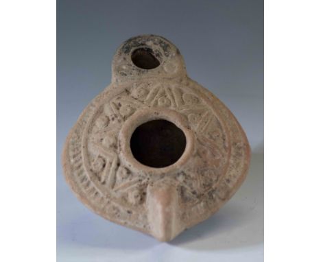 Roman-Palestinian Grey Terracotta Oil Lamp4th Century AD.A terracotta oil lamp, the discuss decorated with motifs, stylised f