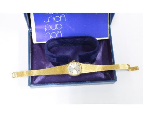 Ladies vintage Tissot wristwatch on an 18ct gold textured strap, with original box 