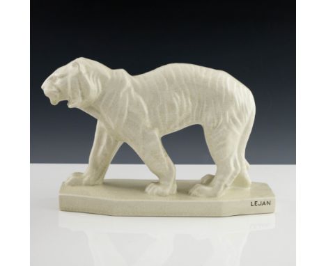 Lejan for Orchies, an Art Deco ceramic figure of a tiger, modelled standing, cream craquelure glaze, painted marks, 40cm long