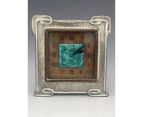 Liberty and Co., an Arts and Crafts Tudric pewter and enamelled clock, model 01693, circa 1910, planished square form with kn