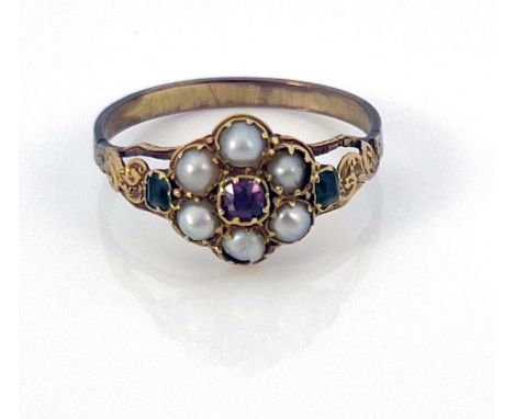 An early 19th century split pearl, emerald and ruby cluster ring, claw set stones and chased foliate scroll shoulders