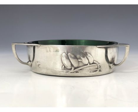 Archibald Knox for Liberty and Co., a Tudric Arts and Crafts pewter and glass butter dish, model 0162, circular with three br