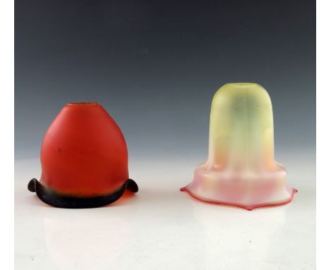 Two Art Nouveau glass light shades, including a frosted pate de verre example and a ribbed graduated opalescent to ruby frost