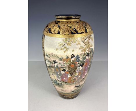 A Japanese satsuma ware baluster vase, Meiji period, 1868-1912, painted with a panel of fashionable ladies and infants and a 