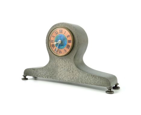 Liberty and Co., an Arts and Crafts Tudric pewter and enamelled mantle clock, model 01294, the 2 inch blue green enamel and c