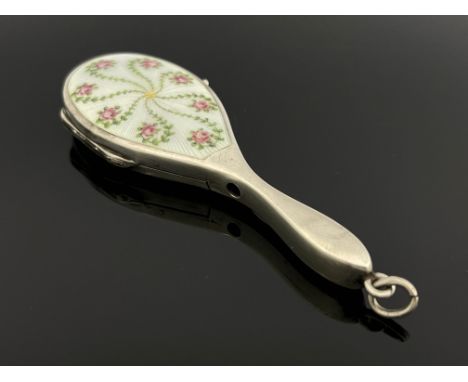 A German silver and enamelled novelty compact, import marks for London 1909, in the form of a hand mirror, sprung lid with gi