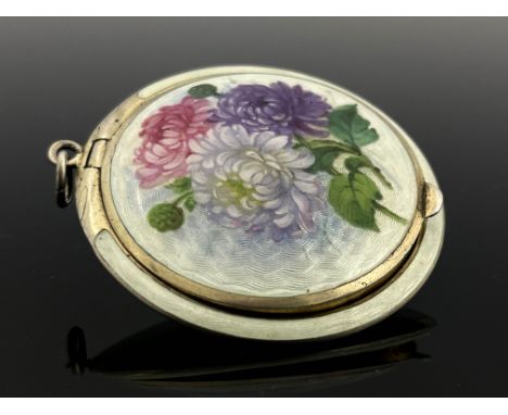 A Norwegian enamelled silver compact, lens form, decorated throughout in pale blue guilloche enamel, the lid painted with chr