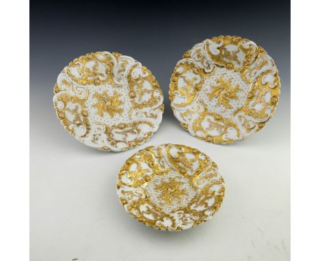 Three early 20th century Meissen Leuteritz rococo relief moulded plates, dished circular form, decorated with fabulous birds 