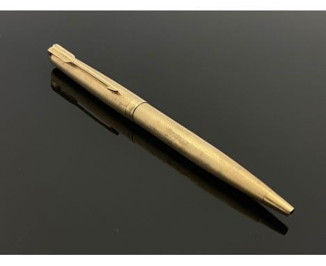 Parker, a 9 carat gold 61 ballpoint pen, 1977, engine turned barleycorn design, 12.5cm long, 15.1g excluding refill