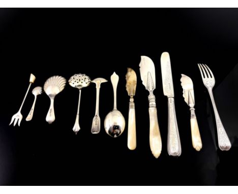 George IV and later silver including mother of pearl handled butter knives, caddy spoons, christening knife and fork, condime