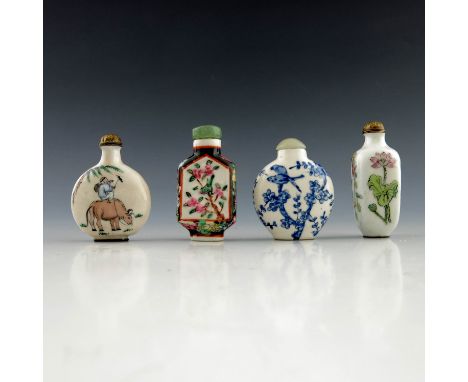 A group of Chinese snuff bottles, to include two of moonflask and shouldered form, painted with birds and with jade stoppers,
