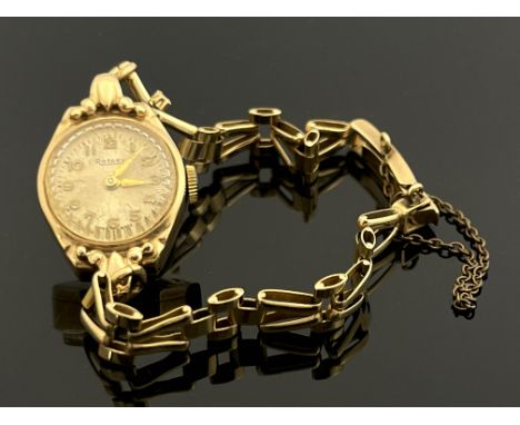 A 9 carat gold ladies Rotary wristwatch, on gold bracelet strap, 13.6g