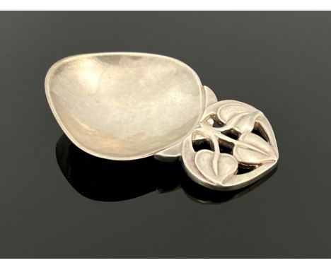 A E Jones, an Elizabeth II Arts and Crafts style caddy spoon, Birmingham 1997, planished pear shaped bowl, pierced and cast f