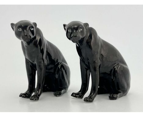 A Royal Worcester pair of figurines, modelled as black panthers, printed marks, 9cm high (2)