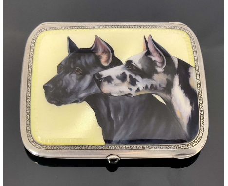 A silver and enamelled cigarette case, the lid painted with two dogs, on yellow guilloche enamel ground, within foliate borde