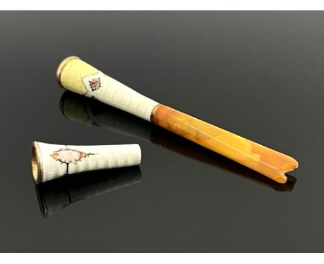 A gold mounted enamelled and amber tipped cheroot holder, together with an enamelled cheroot tip, each in white guilloche ena