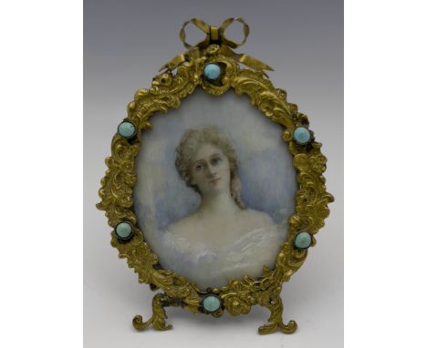 An Art Nouveau portrait miniature in gilt and gem set frame, the oval foliate moulded frame with turquoise cabochons, surmoun