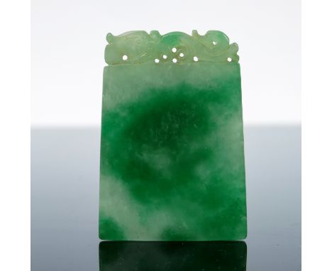 A Chinese jade pendant, tapered slab form, the top carved and pierced with a recumbent dragon, 5.8cm long