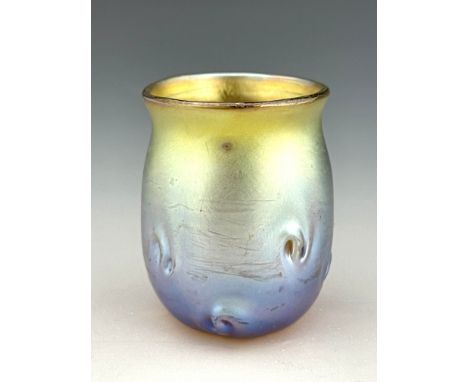 Louis Comfort Tiffany, an Art Nouveau iridescent glass miniature vase, circa 1910, rounded beaker form with everted rim, moul