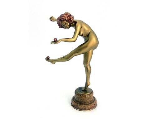 Claire Colinet, Juggler, an Art Deco gilt bronze figure, circa 1925, modelled as a nude woman with three juggling balls, high