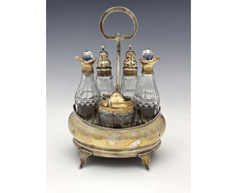 A George III silver cruet and stand, Aleander Field, London 1803, bombe boat form, reeded, on ogee fret cut bracket feet, wit