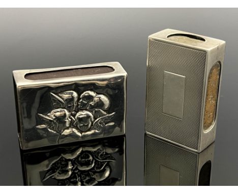 Two silver match box cases, including C J Viner, London 1938, engine turned cuboid form, the other with Reynolds angels embos