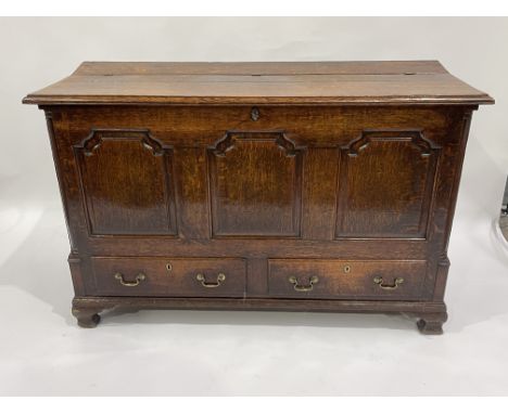 A George III country oak mule chest, circa 1770, moulded hinged top, inner side till drawers and storage flap, triple fielded