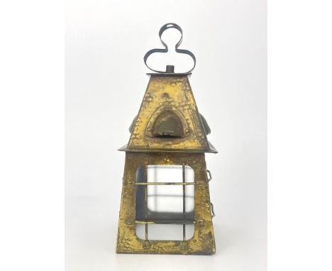 An Arts and Crafts brass lantern light fitting, pyramidal form with four frosted panes, each with wire cage, planished and ri