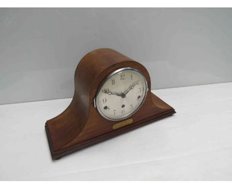 A mahogany cased Napoleon hat mantel clock with Arabic silvered dial and presentation plaque, three train movement, 24cm high