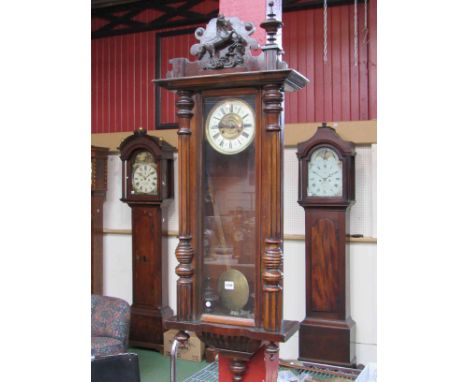 An early 20th Century Vienna wall clock with Roman numerated dial on brass, horse and finial cornice