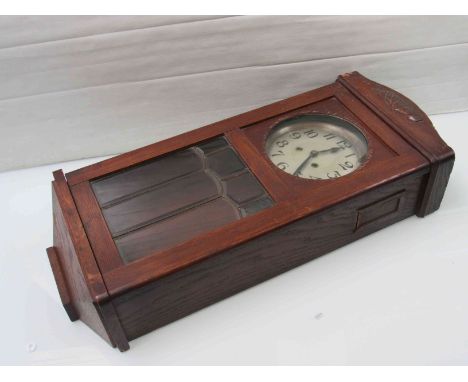 An early to mid 20th Century oak cased wall clock, silvered Arabic dial, 8-day movement, key and pendulum