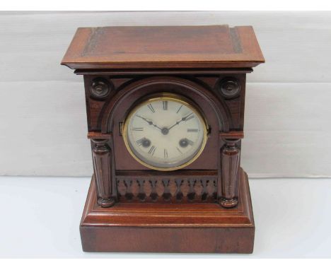A late 19th Century mahogany mantel clock of architectural form, Roman dial, 30cm high
