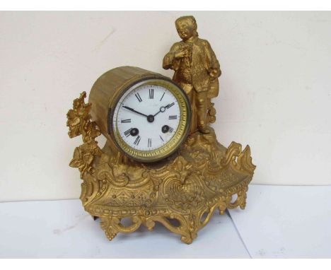 A 19th Century French gilt figural clock with Roman enamel dial, 8-day striking movement, key and pendulum 
