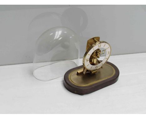 A mid 20th Century Kundo mantel clock under glass dome, with paperwork