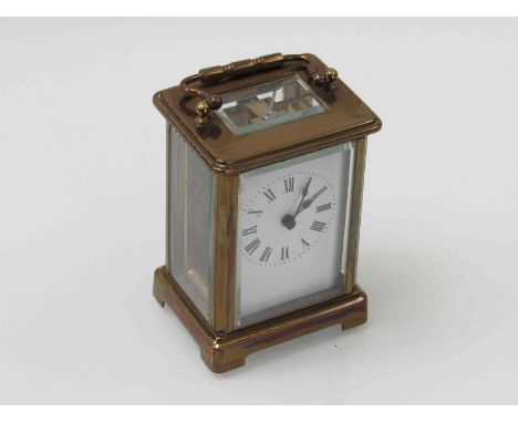 An early 20th Century French brass carriage timepiece, Roman enamel dial