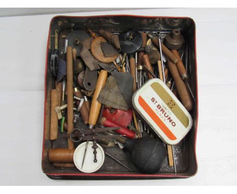 A box of clockmaker's tools including lathe gravers