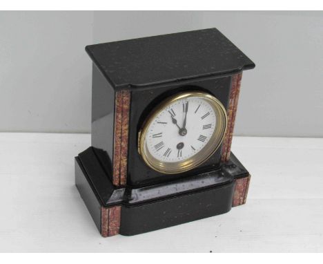 A Victorian marble mantel clock with key and pendulum