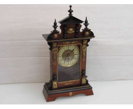 An early 20th Century Amercian walnut, ebonised and gilt mantel clock, 56cm high