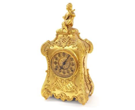 Gilt metal two train ornate mantel clock, the 4.25" dial within an ornate case with gilt metal foliate mounts surmounted by t