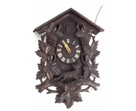 Black Forest two train cuckoo wall clock, within a chalet case, 28" high overall (pendulum and two weights)