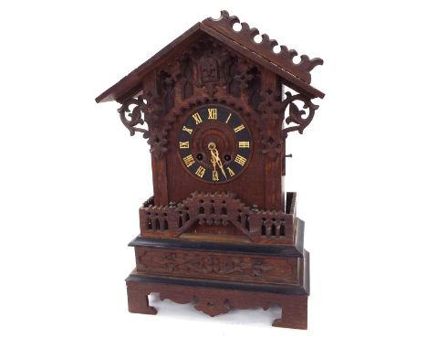 Black Forest two train cuckoo clock, the 5.5" dial within a carved chalet stepped case (in need of restoration with no weight