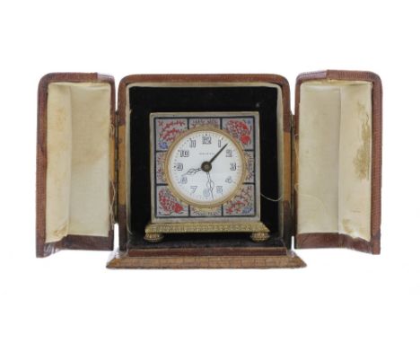 Zenith miniature alarm clock, within a square silvered case decorated with fish and stylised marine life, inscribed to the in