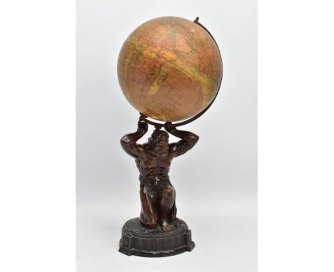 AN EARLY 20TH CENTURY GEOGRAPHIA 8 INCH TERRESTRIAL GLOBE, the paper covered globe supported on a bronzed spelter figure of A